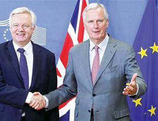 As London squabbles, full Brexit talks start in Brussels