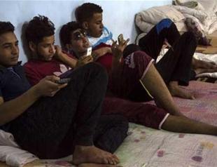 Separated by war, Iraqi children wait for parents