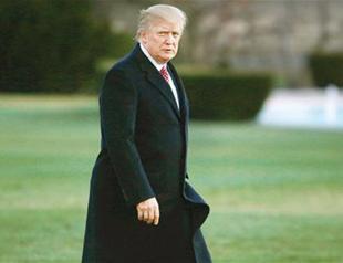 Trump signs revised travel ban, exempts Iraqi citizens