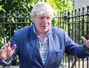 Tottering Theresa May names new UK Cabinet as critics circle