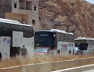 Syrian rebels start leaving Damascus district under evacuation deal