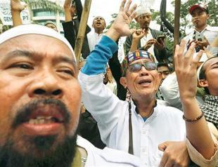 Jakarta’s governor jailed for 2 years for blasphemy