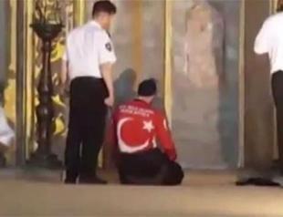Two men perform prayers inside Istanbul’s Hagia Sophia to protest its closure to Muslim worship