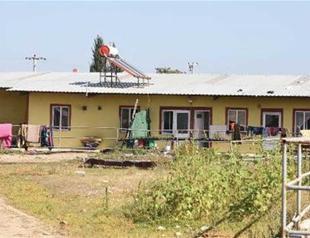 Syrian refugees take shelter in abandoned cattle farm in northwestern Turkey