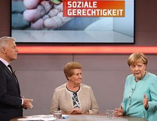 Merkel welcomes release of German-Turkish author in Spain