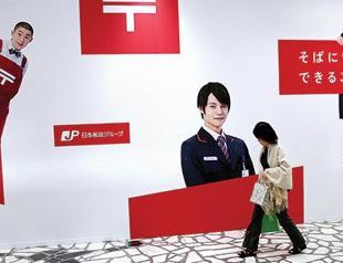 Japan aims to raise $12 bln in postal giant share sale