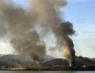 N Korea holds off on Guam missile plan