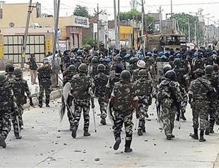 Followers of Indian guru end impasse