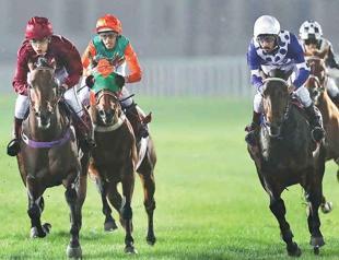 Female jockey gallops where male hold reins