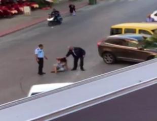Police officer arrested after beating up woman on street in Antalya