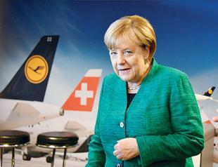 Refugee issue looms as Merkel starts coalition talks