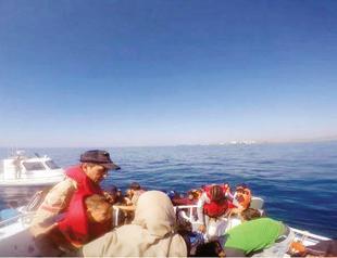 Turkish district governor encounters refugee boat during maritime inspection