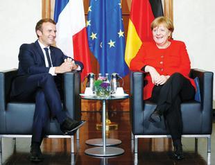Macron urges Merkel to fight for EU revival