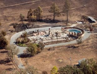 California wildfires kill at least 31 as wind continues to fan flames