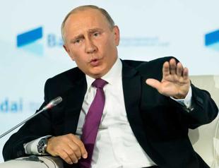 Putin dials up anti-U.S. rhetoric, keeps mum on re-election