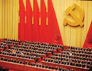 Xi joins Mao in Communist constitution, tightening grip