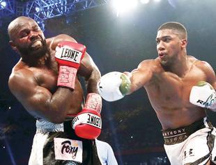 Joshua retains world heavyweight titles