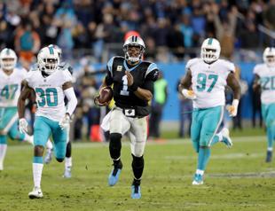 Newton throws for four TDs as Panthers rout Dolphins
