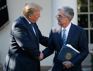 Fed nominee Powell defends bank regulation, sees higher rates