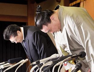 Sumo champ steps down after attack on rival