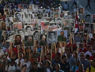 Cubans march in memory of Castro