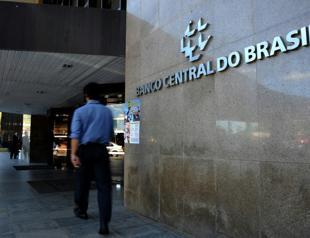 Brazil cuts interest rate to record low seven percent