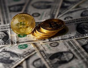 Bitcoin plunges 15 pct in wild trading