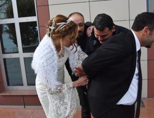 Bride handcuffs groom during wedding ceremony in central Turkey