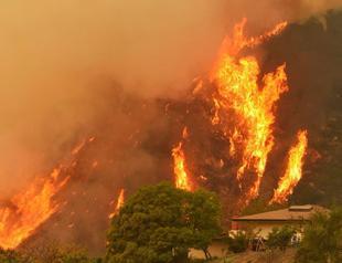 Firefighter killed battling massive California blaze