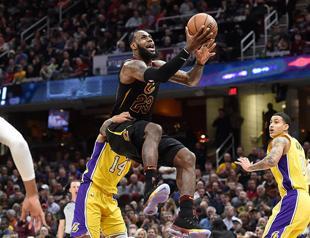 James triple-double fuels Cavs