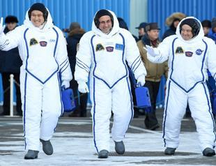 Two rookie astronauts, cosmonaut blast off to International Space Station