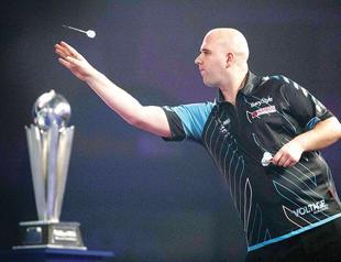 Cross stuns Taylor in world dart final