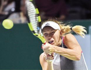 Wozniacki continues march in Auckland
