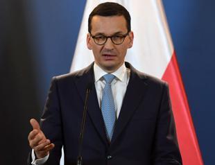 Polish PM sacks key ministers in move to mend EU ties