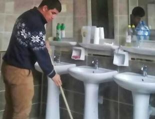 Investigation launched over photo showing Turkish national wrestler mopping floors