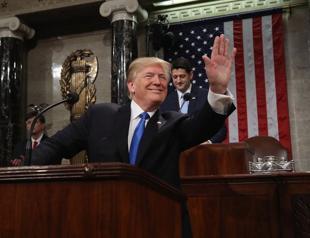 Trump makes appeal for unity after divisive first year