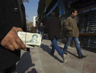 Iran raises rates, closes accounts to shore up rial