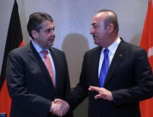 Turkish and German foreign ministers meet in Munich, pledge closer dialogue