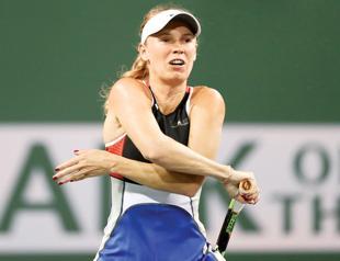 Halep, Venus advance as Wozniacki knocked out