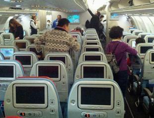 Airport worker returns $74,404 left on plane