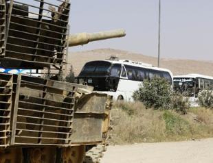 First rebels quit Syria enclave under Russia-brokered deal