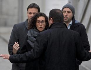 Catalan separatists face charges as key figure flees abroad