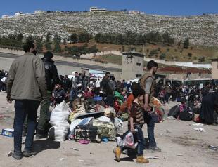 Thousands more leave enclave in Syria’s Ghouta as Assad takes back control