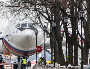 Expelled Russians arrive home as Moscow warns against travel to UK