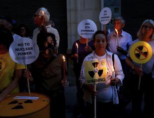 Turkish and Greek Cypriots link arms to protest planned Russian nuclear plant