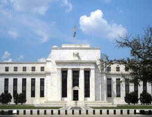 Fed leaves key interest rate unchanged, notes rising inflation