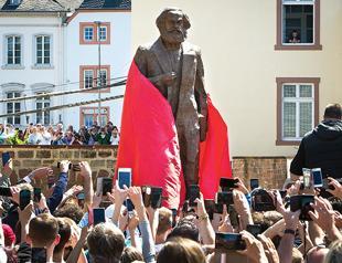 Marx’s German birthplace unveils controversial statue of him