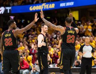 LeBron leads Cavs sweep, Sixers triumph to stay alive