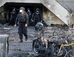 Family of suicide bombers attack Indonesian churches, at least 13 dead