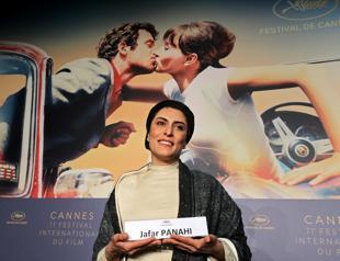 Barred Iranian director gets standing Cannes ovation